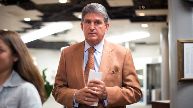 PHOTO: Sen. Joe Manchin, walks through the basement of the Capitol en route to the senate luncheons, May 22, 2012.