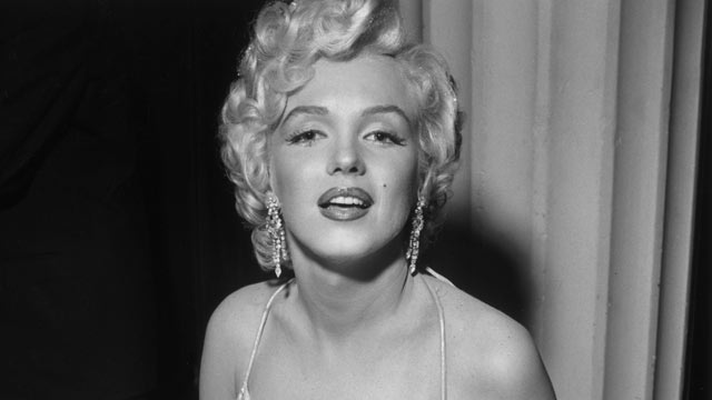 PHOTO: Marilyn Monroe sits at a banquet table during a party for studio executive Darryl F Zanuck in the Hollywood Hilton, Hollywood, Calif., early 1950s.