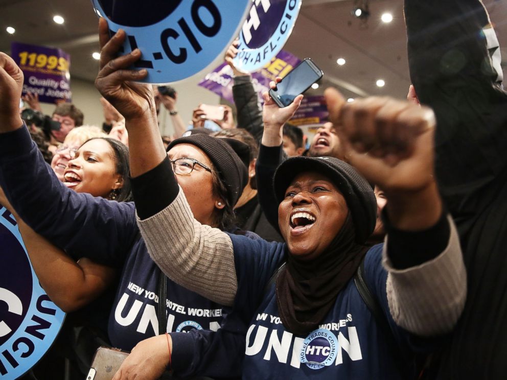 PHOTO: People cheer as Democratic presidential candidate Hillary Clinton joins New York Governor Andrew Cuomo at a rally on April 4, 2016 in New York City.