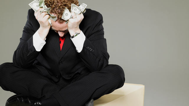 PHOTO: Money resolutions may be difficult to keep in 2013.