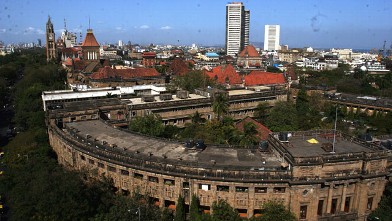 PHOTO: Aerial View of the Rajabai Clock Tower, Bombay Stock Exchange Building, Mumbai University and Mumbai City in Mumbai, Maharashtra, India.