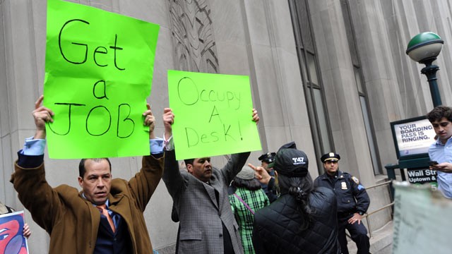 PHOTO: Derrick Tabacco, left, a small business owner, and an unidentified man counter demonstrate against the 'Occupy Wall Street' march near the New York Stock Exchange, Nov. 17, 2011 in New York.