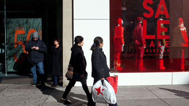 PHOTO: Shoppers walk past window displays on 34th Street, Dec. 26, 2011 in New York City.