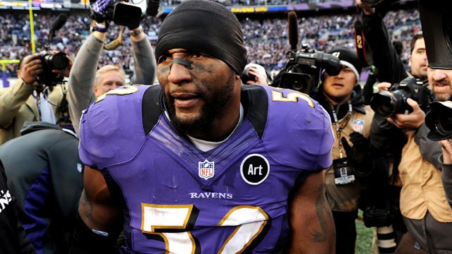 PHOTO: Ray Lewis of the Baltimore Ravens is mobbed by the media after defeating the Indianapolis Colts, Jan. 6, 2013 in Baltimore, Md.