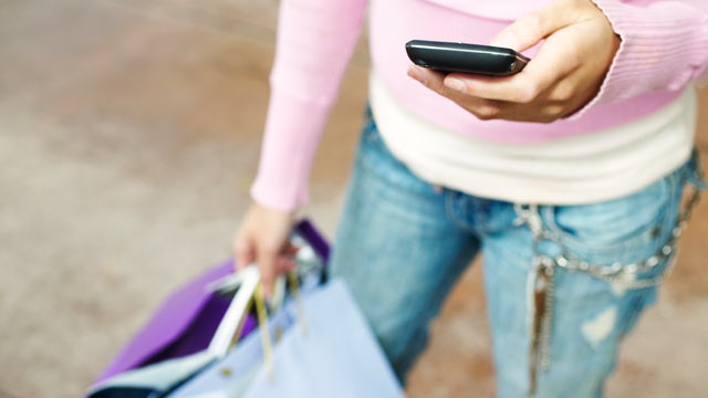 PHOTO: Shoppers can use their mobile devices and check-in apps for deals sometimes without making a purchase.