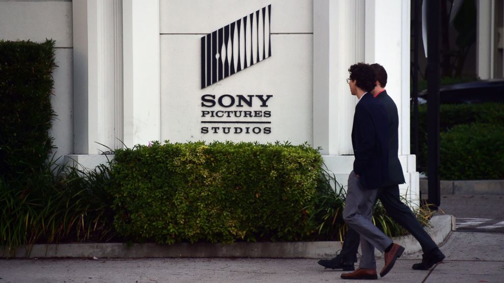 PHOTO: Pedestrians walk past an exterior wall to Sony Pictures Studios in Los Angeles, Dec. 4, 2014.