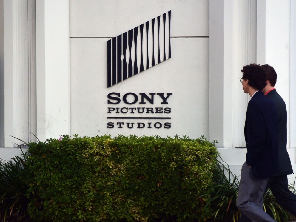 PHOTO: Pedestrians walk past an exterior wall to Sony Pictures Studios in Los Angeles, Calif. on Dec. 4, 2014.