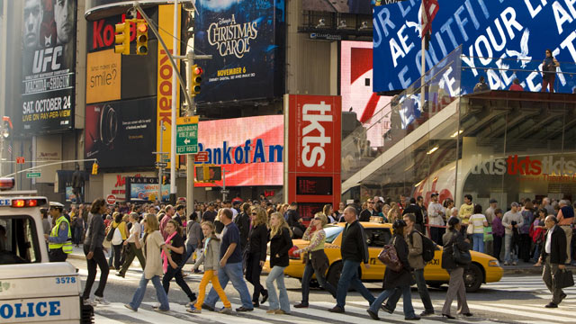 PHOTO: Traffic and people along 7th Avenue near Broadway and Times Square are seen against a backdrop of advertising billboards in this New York, NY, early afternoon cityscape photo, 2009.