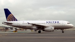 PHOTO: An Airbus A319 jet painted in United Continental Holdings Inc.'s new livery following the airlines' merger taxis down the runway at San Francisco International Airport in San Francisco, California, U.S., on Feb. 23, 2011.