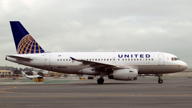 PHOTO: An Airbus A319 jet painted in United Continental Holdings Inc.'s new livery following the airlines' merger taxis down the runway at San Francisco International Airport in San Francisco, California, U.S., on Feb. 23, 2011.
