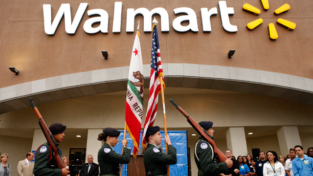 PHOTO: The North Torrance High School Junior Reserve Officer Training Corps color guard presents the U.S. flag and California state flag before the grand opening of a new Wal-Mart Stores Inc. location in Torrance, Calif, Sept. 12, 2012.