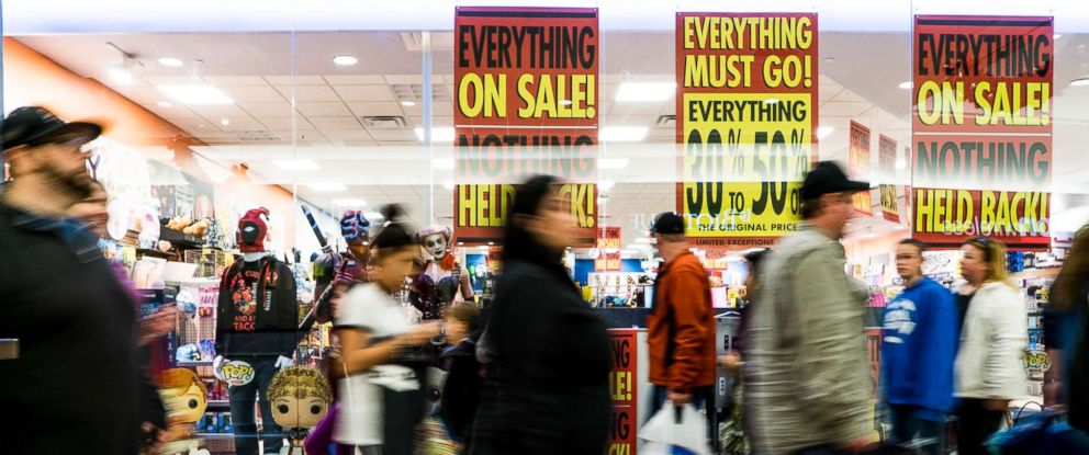 PHOTO:Shoppers stream past advertisements for Black Friday sales at the Maine Mall in South Portland Friday, November 25, 2016.