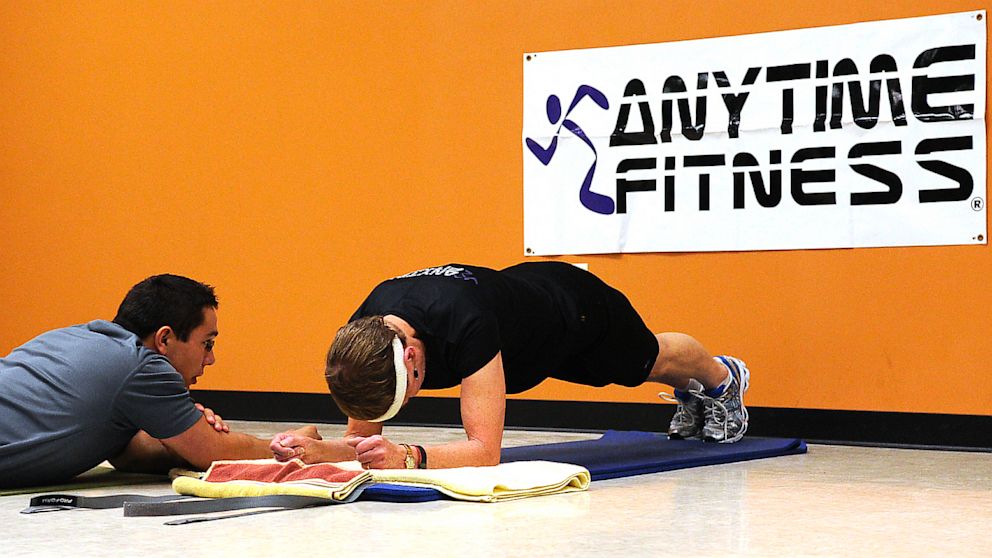 PHOTO: With her trainer, Dave Candra at her side, Betty Sweeney, 71, of Plover, Wis. unofficially breaks the Guinness World Record for holding the plank position, an abdominal exercise on September 28, 2011. 