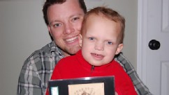 PHOTO: Jason LeBlanc pictured with his son, Alex, bought an 1865 baseball card for $92,000.