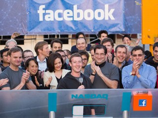 PHOTO: Mark Zuckerberg, CEO and founder of Facebook, and COO Sheryl Sandberg gather with a throng of cheering employees at the company headquarters in Menlo Park, Calif. to ring the stock market's opening bell, May 18, 2012.