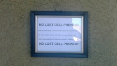 PHOTO: A sign posted near Wayne Dobson's front door in North Las Vegas tells people he doesn't have lost cell phones.