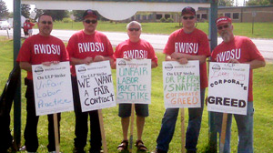 PHOTO Workers at a Mott?s plant near Rochester, New York, like the ones seen here, have vowed to stay on the picket line until parent company Dr Pepper Snapple agrees not to cut their hourly wages.
