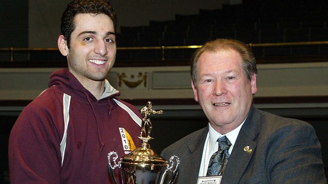 PHOTO: Tamerlan Tsarnaev, left, accepts the trophy for winning the 2010 New England Golden Gloves Championship in Lowell from Dr. Joseph Downes. (SUN/JULIA MALAKIE)