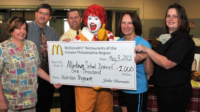 PHOTO: From left: Donna Schuler, Joe Bonita, David Hahn, Ronald McDonald, Vickie Kahler, and Sue Ennis, present a $1,000 donation from McDonald's to support nutrition and fitness education for ASD elementary students.
