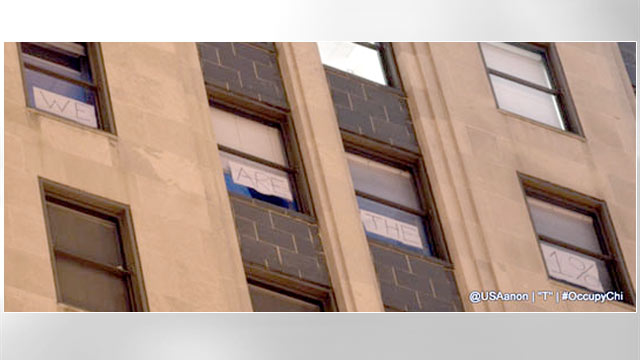 PHOTO: A sign posted briefly in the windows of the Chicago Board of Trade and just as hastily taken down, visible to protesters in the street, declared, "We Are The 1%."