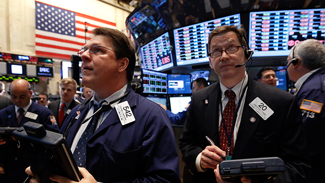 PHOTO: Traders work on the floor at the New York Stock Exchange, June 20, 2013
