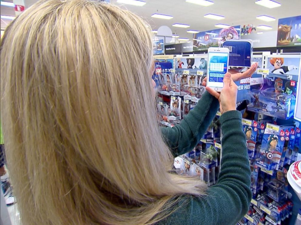 PHOTO: ABC News Becky Worley compares online prices to prices in a store at a mall in Columbus, Ohio.