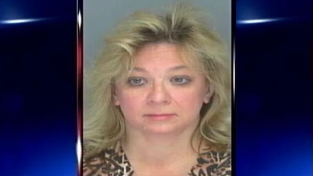 VIDEO: Darlene Jo Lewis, 49, is suspected of making personal purchases with Georgia troops money.