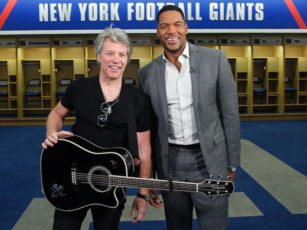 PHOTO: ABC News Michael Strahan, right, joined Jon Bon Jovi at MetLife Stadium in New Jersey as the rock singer surprised the graduating class at Fairleigh Dickinson University commencement with a performance.