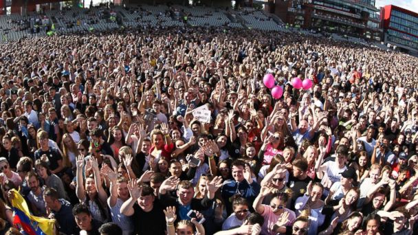 PHOTO: Members of the crowd are pictured at the One Love Manchester tribute concert in Manchester, north western England, June 4, 2017. 