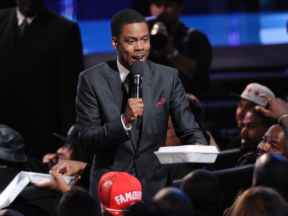 PHOTO: Host Chris Rock hands out fried chicken and waffles at the BET Awards at the Nokia Theatre, June 29, 2014, in Los Angeles.