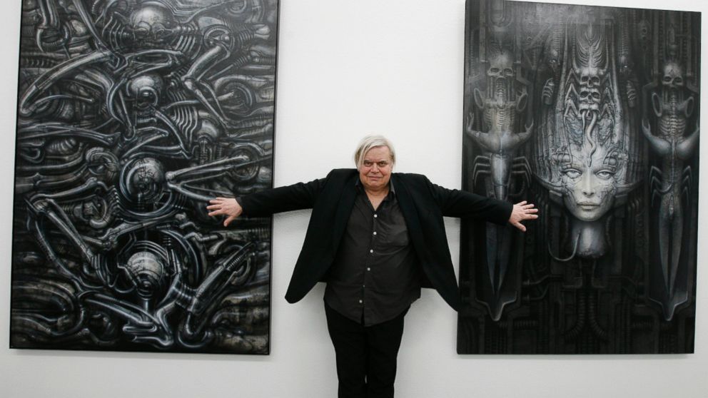 PHOTO: Swiss artist H.R. Giger  poses with two of his works at the art museum in Chur, Switzerland, June 29, 2007.