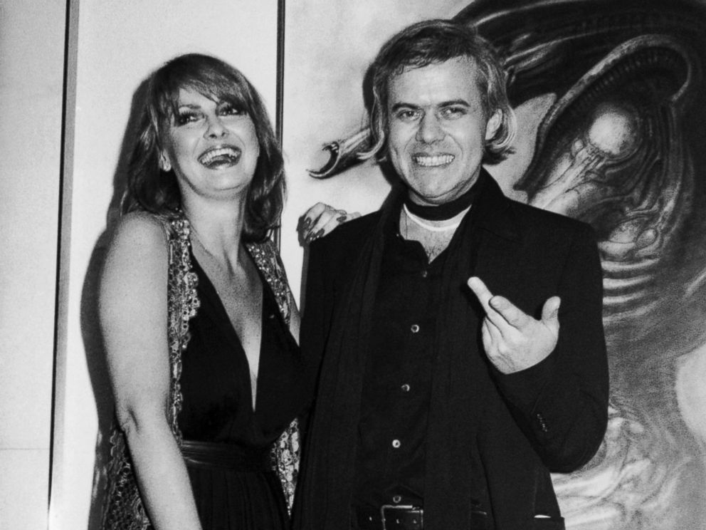 PHOTO: In this April 1980 file photo, Swiss artist H.R. Giger, right, poses with model Anneka Vasta at the opening of an exhibition in New York.