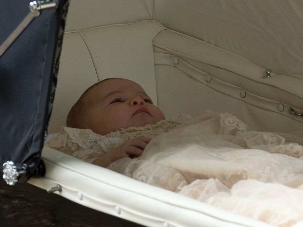 PHOTO: Britains Princess Charlotte is pushed in a pram by her mother Kate the Duchess of Cambridge as they arrive for Charlottes Christening at St. Mary Magdalene Church in Sandringham, England, July 5, 2015. 