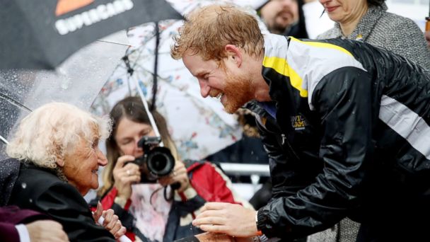 PHOTO: Prince Harry hugs Daphne Dunne at the Overseas Passenger Terminal, June 7, 2017, in Sydney.