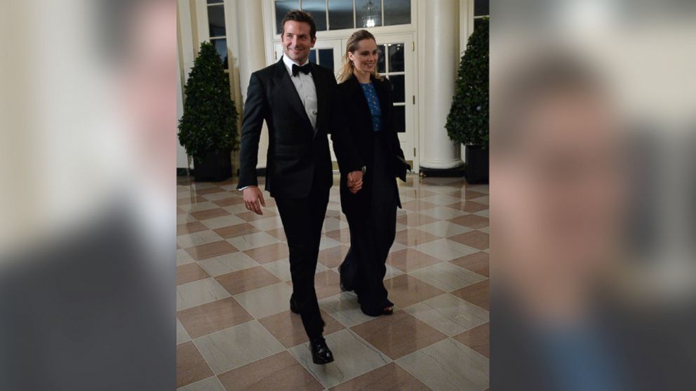 PHOTO: Actor Bradley Cooper and Suki Waterhouse arrive at the White House for the state dinner in honor of French President Francois Hollande on Feb. 11, 2014.