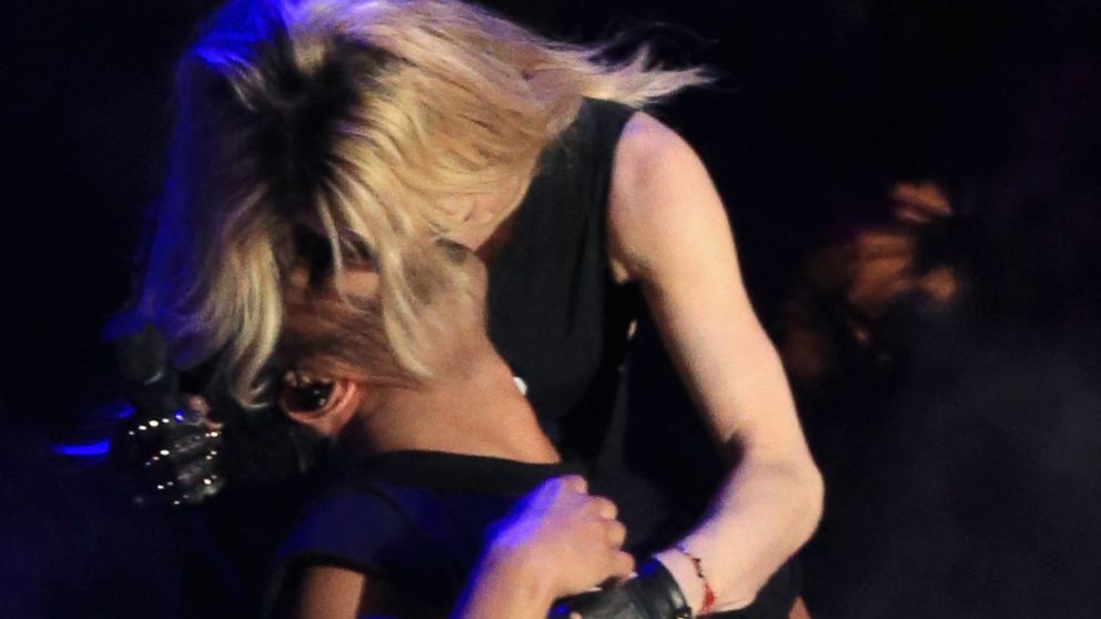 PHOTO: Recording artists Madonna and Drake kiss onstage during day 3 of the 2015 Coachella Valley Music & Arts Festival at the Empire Polo Club on April 12, 2015 in Indio, California.