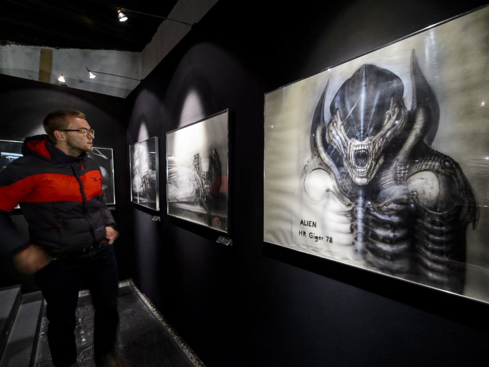 PHOTO: A visitor faces a preparatory sketch for Alien movie at the HR Giger Museum on May 13, 2014 in Gruyeres.