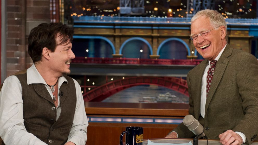 PHOTO: Johnny Depp, left, chats with David Letterman, right, on April 3, 2014 in New York City. 