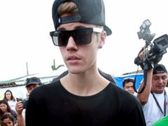 PHOTO: Justin Bieber visits typhoon affected people in San Jose Elementary School in Tacloban, Leyte, Philippines, Dec. 10, 2013. Bieber previously launched a campaign to help raise money for the victims of super Typhoon Haiyan.