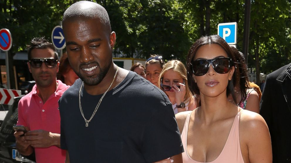 PHOTO: Kim Kardashian and Kanye West are seen strolling on the Avenue Montaigne on May 19, 2014 in Paris, France.