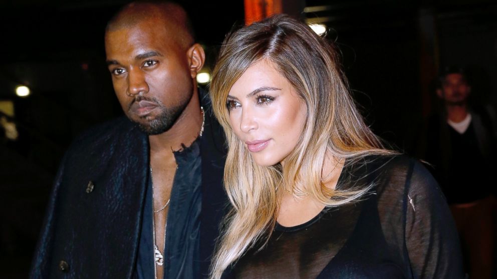 PHOTO: Kim Kardashian and Kanye West during Paris Fashion Week, Sept. 29, 2013, in Paris.
