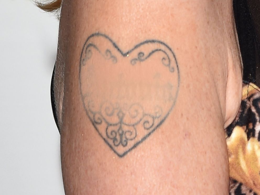 PHOTO: Melanie Griffiths tattoo is pictured partially obscured during the 60th Taormina Film Fest