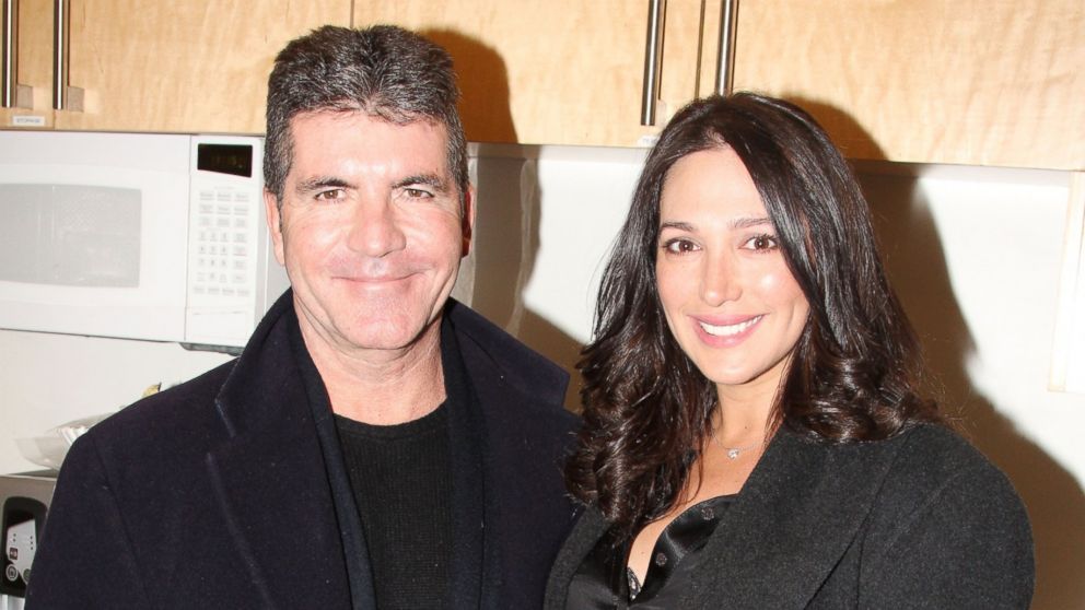 PHOTO: Simon Cowell, left, and partner Lauren Silverman, right, are pictured on Jan. 25, 2014 in New York City.