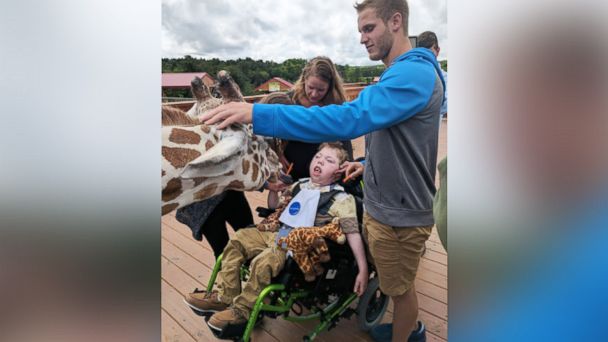 PHOTO: Alex Johnson, 11, was granted his wish by the Make-A-Wish Foundation to visit April the giraffe and her calf, Tajiri, at Animal Adventure Park.
