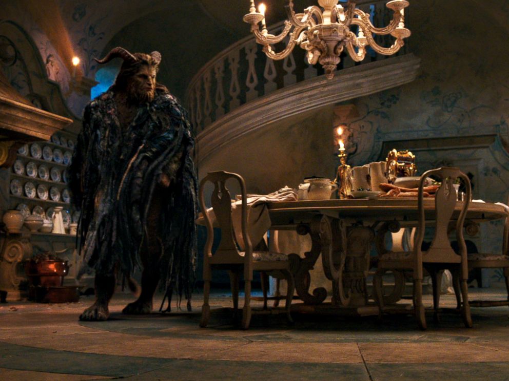 PHOTO: The Beast (Dan Stevens) with Lumiere the candelabra and Cogsworth the mantel clock in the castle kitchen in Disneys Beauty and the Beast, an adaptation of the studios animated classic.