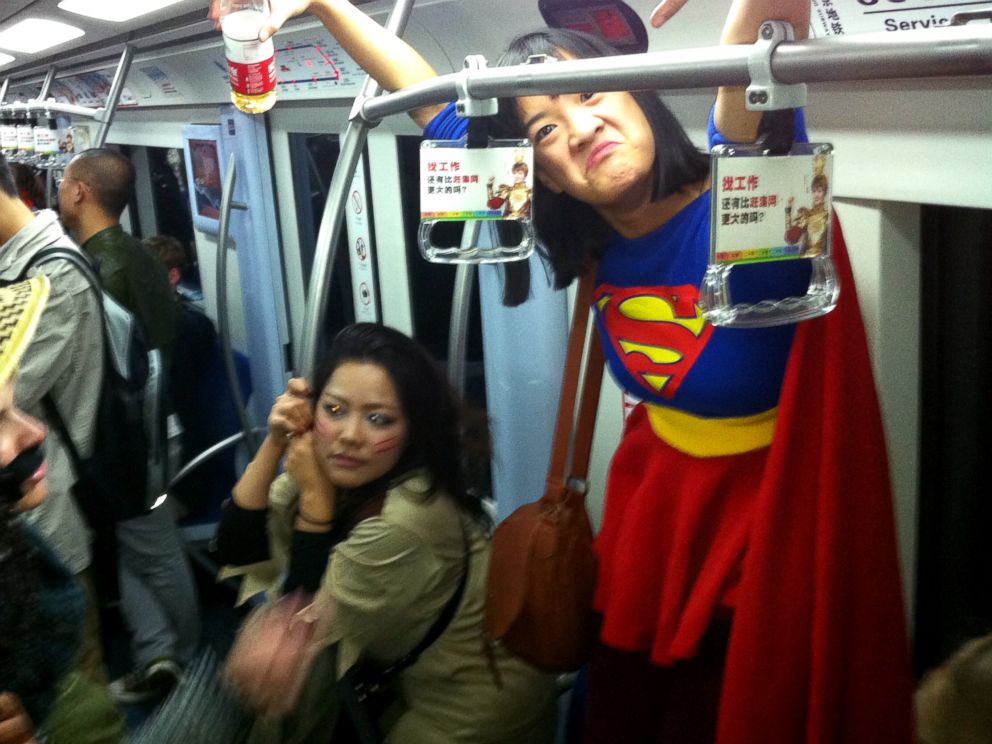 PHOTO: Commuters are seen in costume on the subway line 2 in Beijing, Nov. 1, 2013.