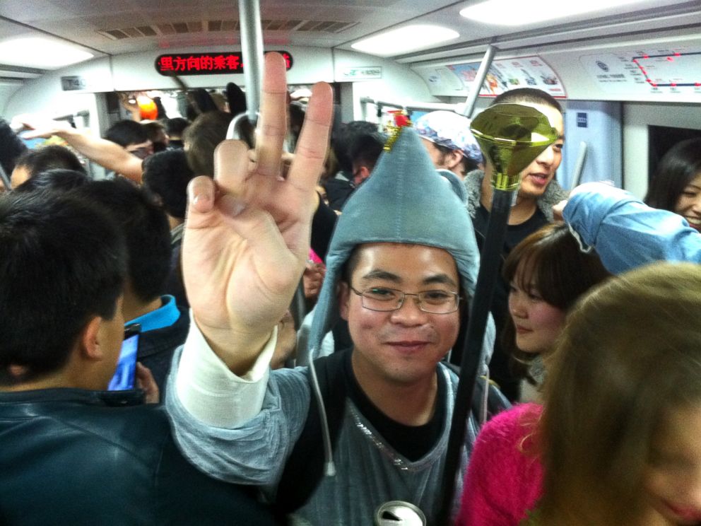 PHOTO: Commuters are seen in costume on the subway line 2 in Beijing, Nov. 1, 2013.