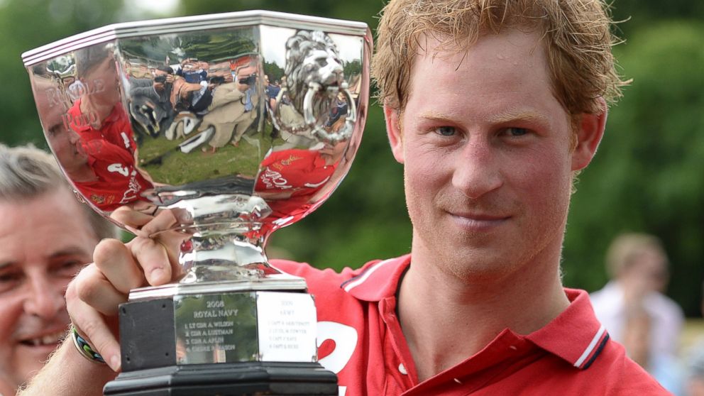 PHOTO: Prince Harry hoists the Hackett Rundle Cup after winning it on Saturday, July 12, 2014.