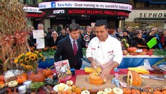PHOTO: Buddy Valastro cuts the cake in half.