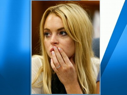 VIDEO: Lohan conveys an explicit message on her fingernail while in court.